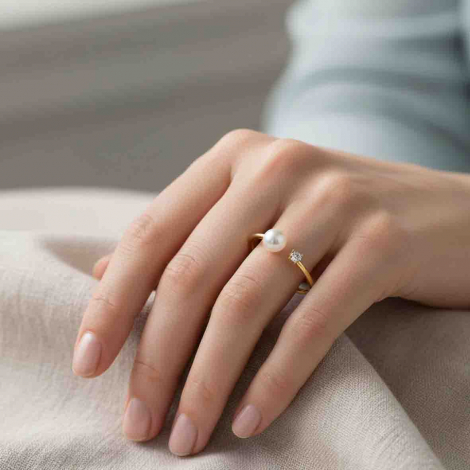 Bague Puret� en or, diamant et perle
